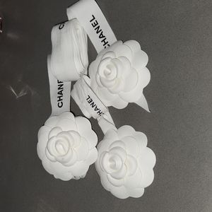 Three CHANEL Ribbons & Camilla Flowers